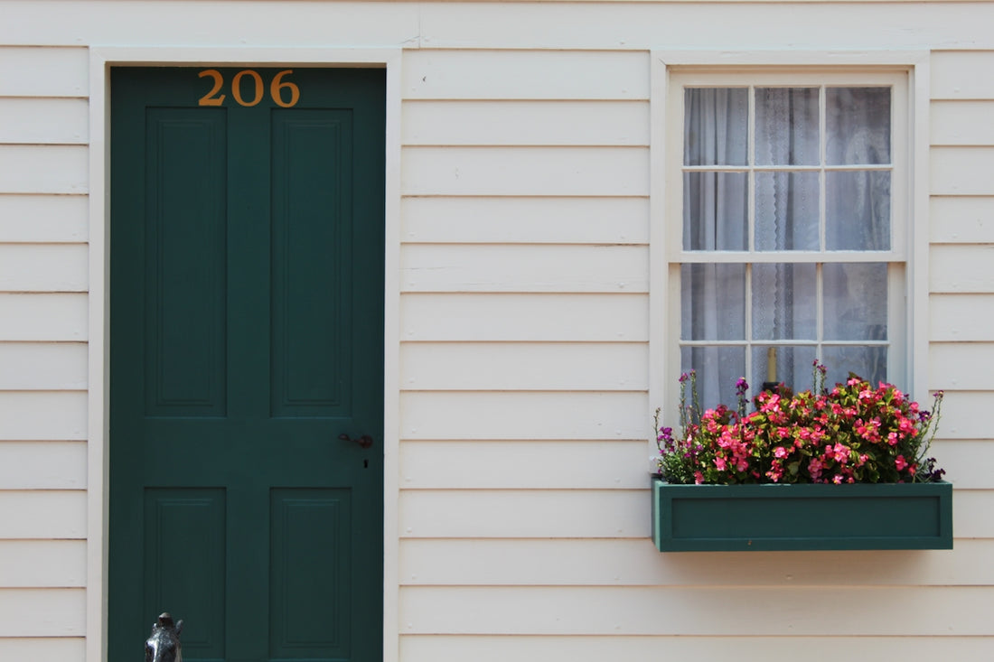 blue wooden door with white wooden frame