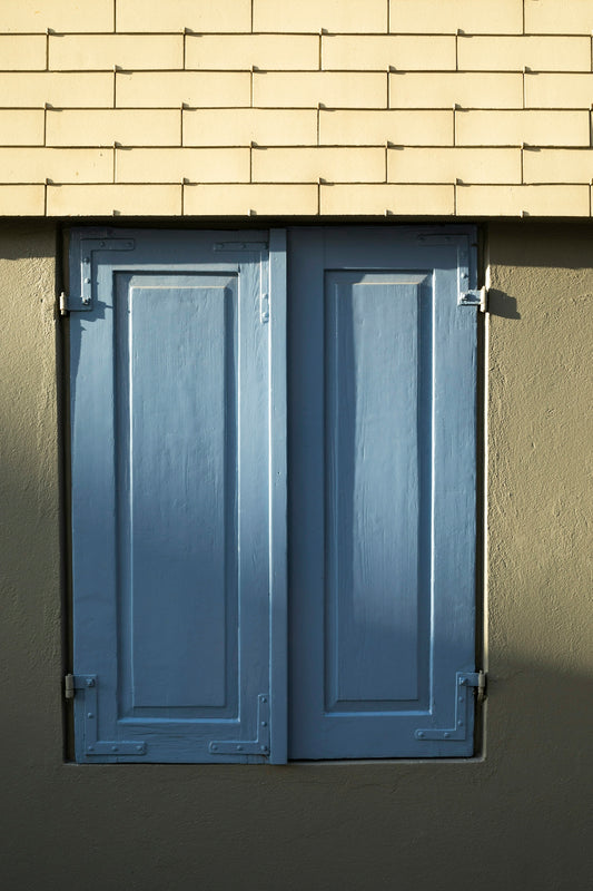 blue wooden door with silver handle