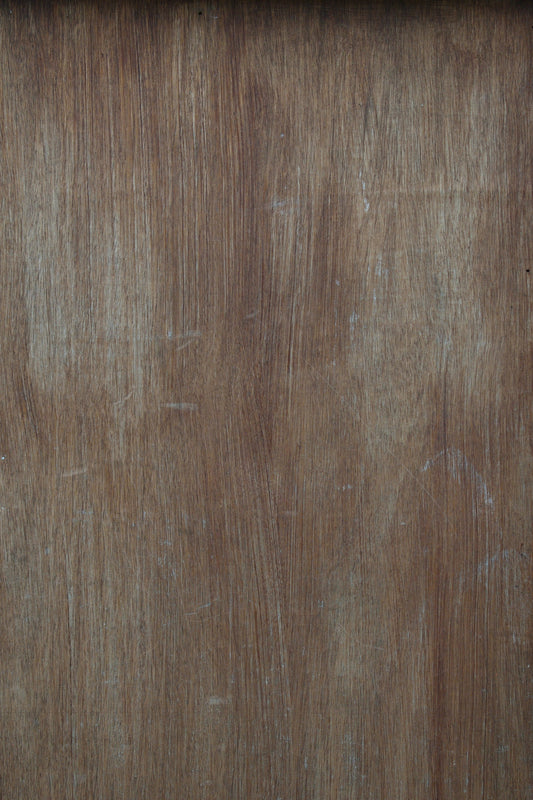 a close up of a wooden surface with scratches