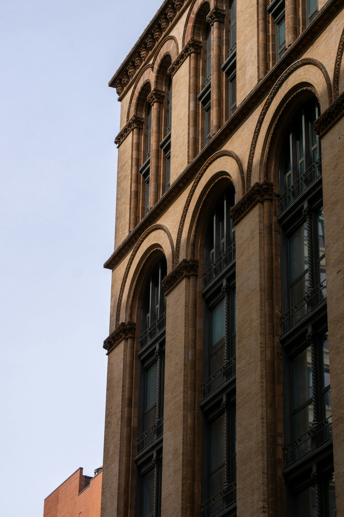 a tall building with a clock on the front of it