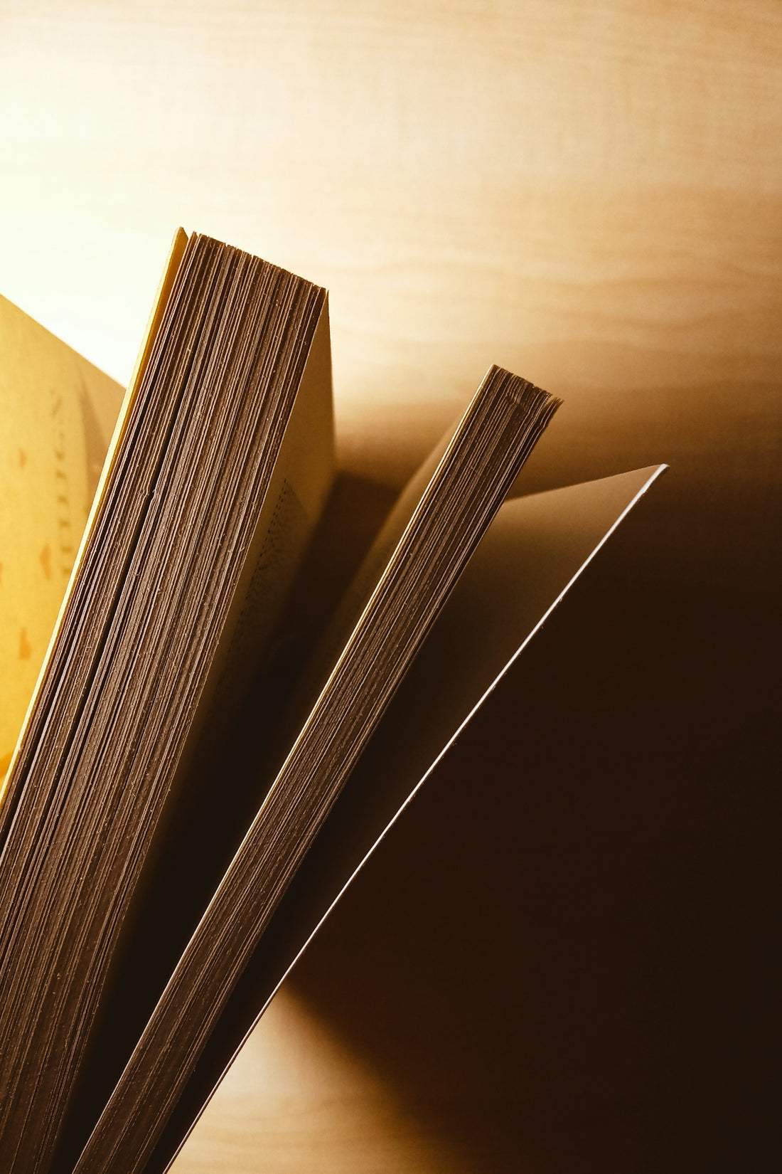 an open book sitting on top of a wooden table